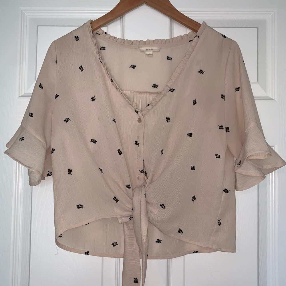 Cream button-down crop with black floral detail